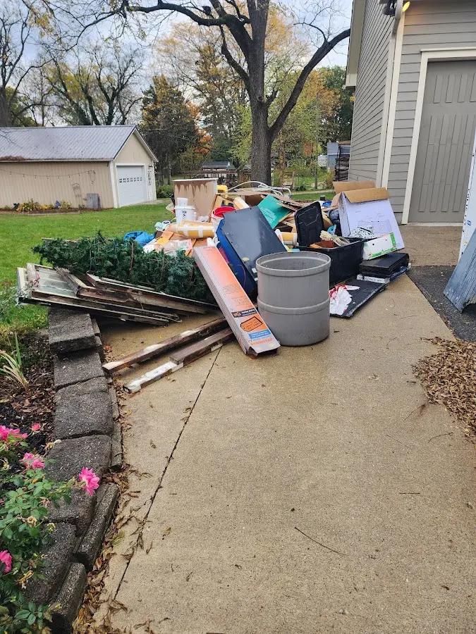 Dumpster being loaded with debris for 3 Yard Dumpster Rental in Harrogate